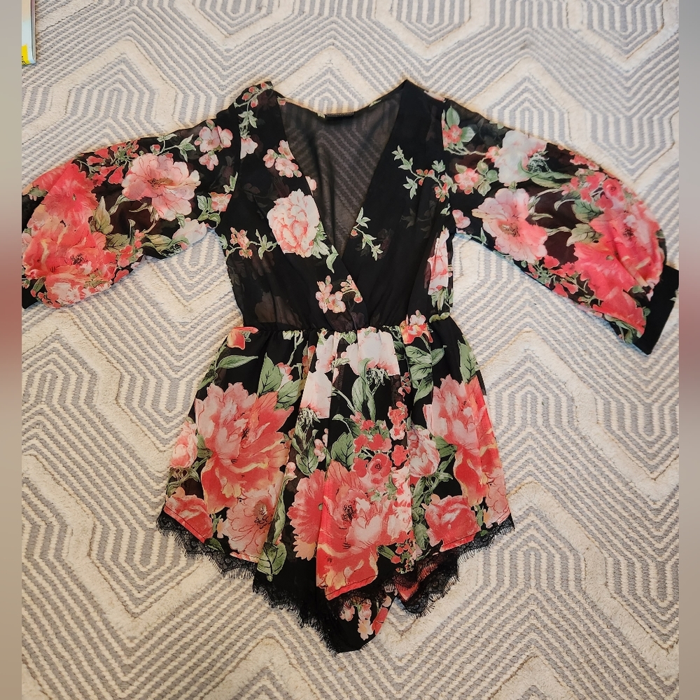 Floral vneck romper with long sleeves and shorts. Size S.